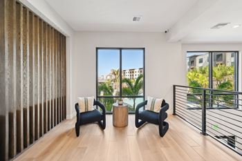 A modern living room with a view of the city.